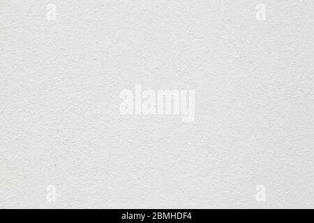Close-up of a plastered wall painted in white. Abstract high resolution full frame textured background. Stock Photo