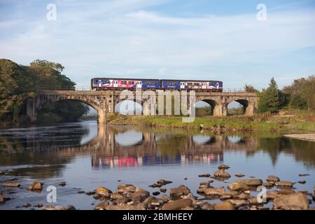 Northern Rail class 150 sprinter train crossing the river lune  viaduct at Arkholme on the scenic 'little north western' railway line in Lancashire Stock Photo