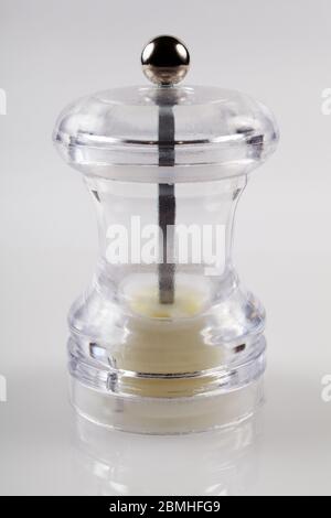 Empty mill for pepper, spices. White background. Close-up Stock Photo