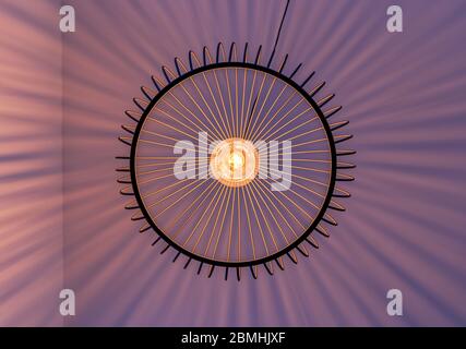 Geometric arranged light rays of a lamp excactly photographed vertical from below. Stock Photo