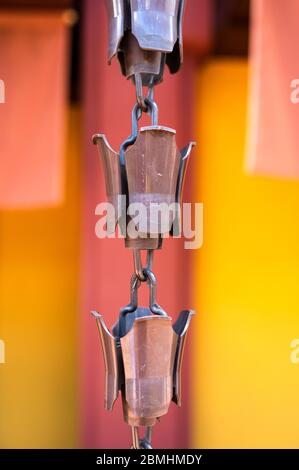 Rainspout consisting of a chain and cups at Nan Lian gardens in Diamond Hill, Hong Kong Stock Photo