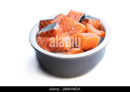 Fresh salmon fillet cubes in clay bowl isolated on white Stock Photo ...