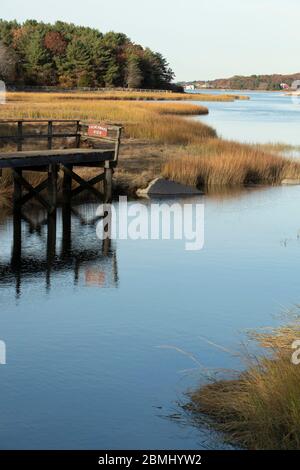 A beautiful small harbor located just west of downtown Gloucester. Coves and marshland are prominent here. Everything turns golden in autumn here. Stock Photo