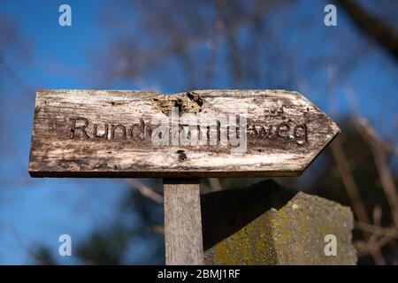 old wooden signpost with german inscription for "circular hiking trail" Stock Photo