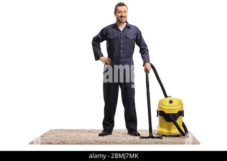 Full length portrait of a janitor hoovering a carpet isolated on white background Stock Photo