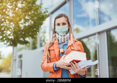 Student during covid-19 cannot enter closed university building Stock Photo