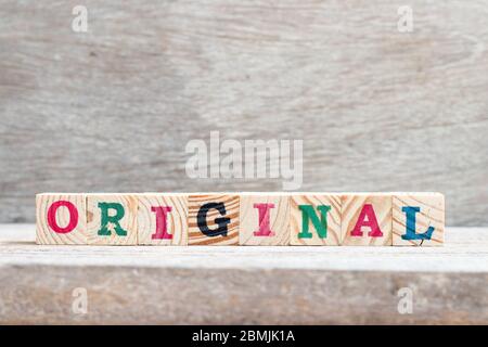 Alphabet letter block in word original on wood background Stock Photo