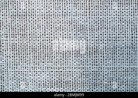 Rubber surface with uneven holes. white plastic texture with dots. abstract background Stock Photo