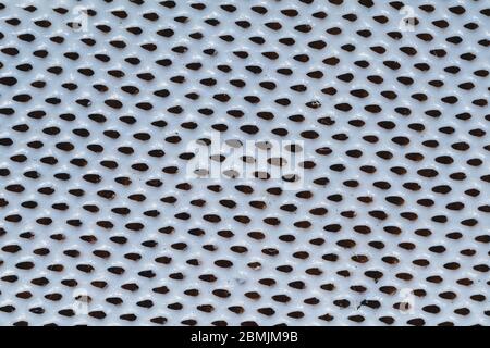 Rubber surface with uneven holes. white plastic texture with dots. abstract background Stock Photo