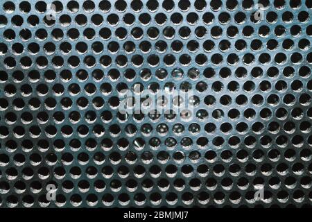 Grid pattern surface. dusty speaker mesh texture close up. perforated plastic. abstract background Stock Photo