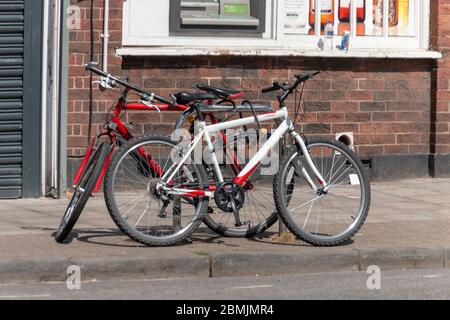 Bristol-May 2020-England-a close up view of two bikes that have been locked up Stock Photo