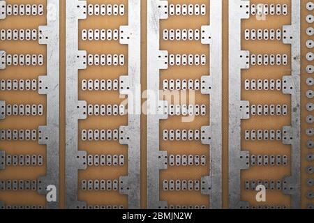 Printed circuit board without elements. textolite surface. template for soldering the circuit. perforated background Stock Photo