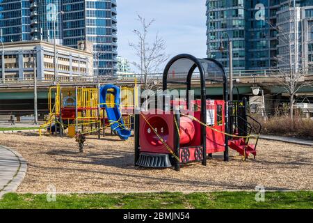 Closed playground at empty park in Downtown Toronto during Coronavirus pandemic, Ontario, Canada. Stock Photo
