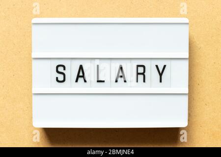 Lightbox with word salary on wood background Stock Photo