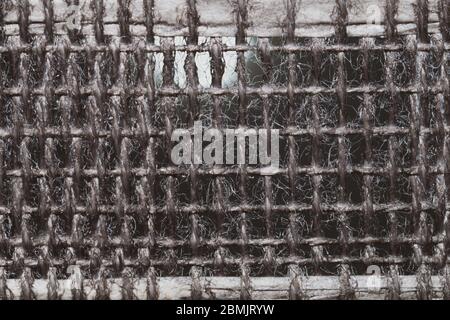 Braided fibers close up. woven texture. wicker background. knitted surface. weaving pattern. stitches of thread Stock Photo