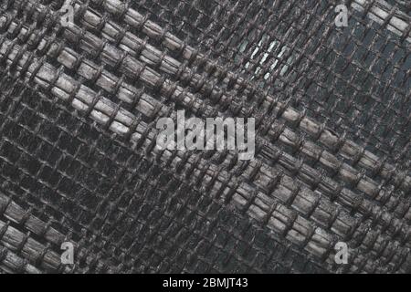 Braided fibers close up. woven texture. wicker background. knitted surface. weaving pattern. weaving from threads Stock Photo