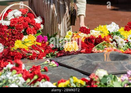 people-present-put-flowers-at-