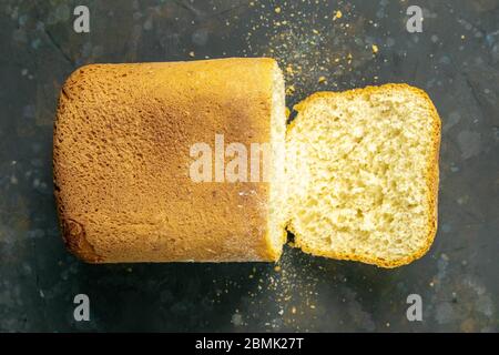 Fresh fragrant bread against a dark background. Assortment of baked bread on dark table background. Fresh fragrant bread on the table. Top views Stock Photo