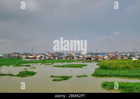 View of the Makoko suburb next to the Lagos lagoon from a highway bridge. Stock Photo