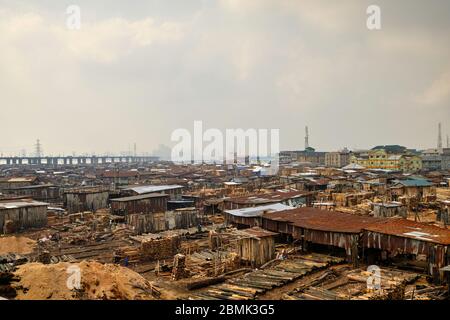 View of the Makoko suburb next to the Lagos lagoon from a highway bridge. Stock Photo