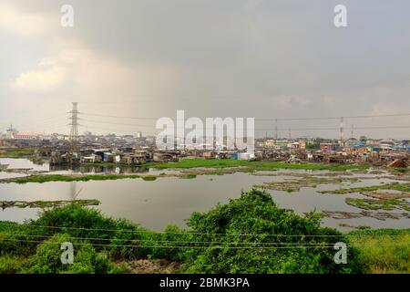 View of the Makoko suburb next to the Lagos lagoon from a highway bridge. Stock Photo