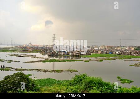 View of the Makoko suburb next to the Lagos lagoon from a highway bridge. Stock Photo