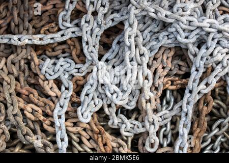 Stack of rusty chains close-up. They use industry and maritime. Close up. Stock Photo