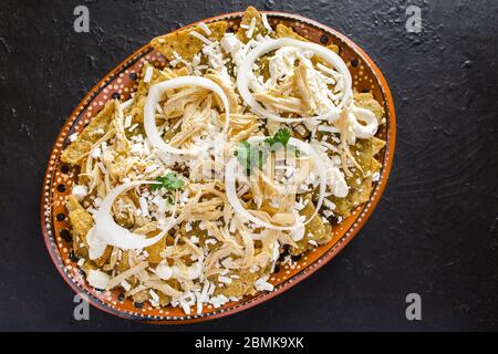 chilaquiles mexican spicy food, avocado, nachos, chicken and cheese mexico Stock Photo