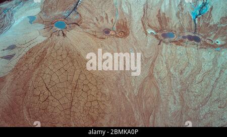 Abstract Aerial View of Red Tailing Ponds with Various Textures Stock Photo