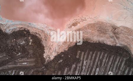 Abstract Aerial View of Red Tailing Ponds with Various Textures Stock Photo