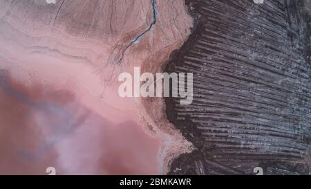 Abstract Aerial View of Red Tailing Ponds with Various Textures Stock Photo