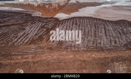 Abstract Aerial View of Red Tailing Ponds with Various Textures Stock Photo