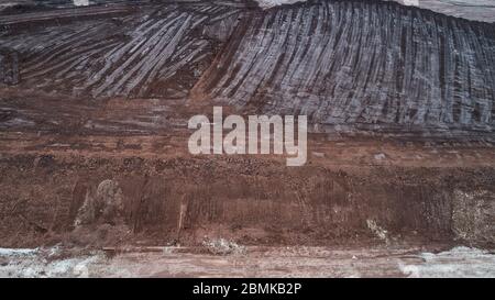 Abstract Aerial View of Red Tailing Ponds with Various Textures Stock Photo