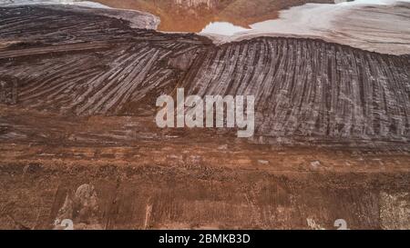 Abstract Aerial View of Red Tailing Ponds with Various Textures Stock Photo