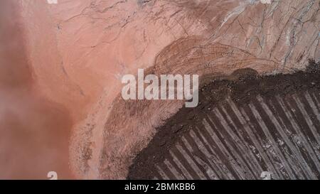 Abstract Aerial View of Red Tailing Ponds with Various Textures Stock Photo