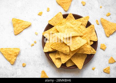 Mexican Corn Chips Nachos, top view, copy space. Tortilla or Nacho Chips for snack. Stock Photo