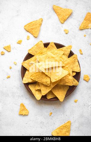 Mexican Corn Chips Nachos, top view, copy space. Tortilla or Nacho Chips for snack. Stock Photo
