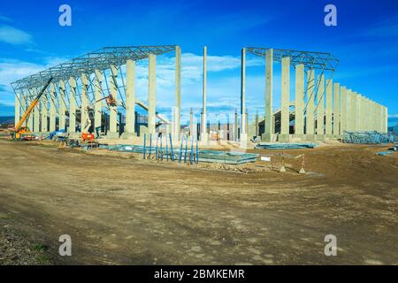The new city football stadium building under construction. Unfinished construction project concept Stock Photo