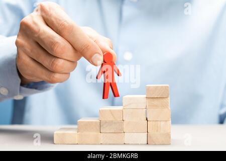Assistance in career growth. Promotion of a leader in a business team. Stock Photo