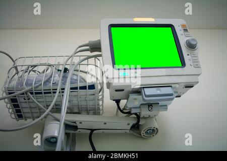 Medical monitor inside patient hospital room. Electrocardiograph in ward room. Mock up screen. Stock Photo