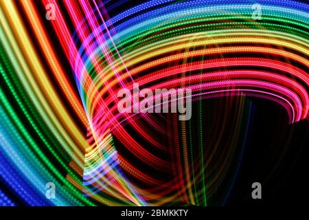 Bright color light on black background. Stock Photo