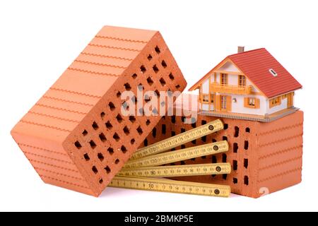 tools and brick as symbol for house construction Stock Photo