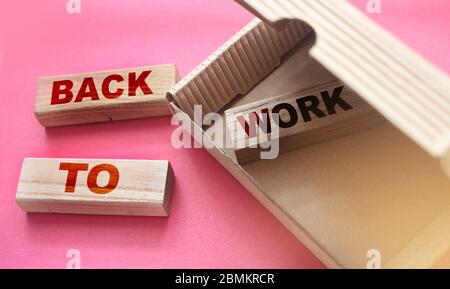Words back to school written on wooden blocks in box and outside. Business recovering concept Stock Photo