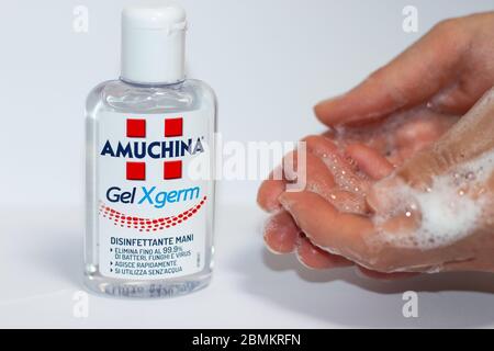 Benevento / Italy - April 27, 2020: Hand taking AMUCHINA Gel XGERM hand  sanitizer to reduce the infectious agent. Virus, fungi and bacteria Stock  Photo - Alamy