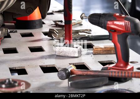Car repair tools on the table in auto repair shop Stock Photo