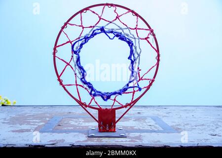 Basketball backboard with a basket on a blue sky,concept of sports, active lifestyle and outdoor recreation Stock Photo