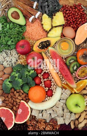 Super food for healthy eating to promote vitality, fitness and energy with health foods high in antioxidants, anthocyanins, protein & omega 3. Stock Photo