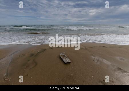 A plastic bottle on a beach in Alexandroupoli Evros Greece Stock Photo