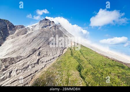 The active Soufriere Hills Volcano in Montserrat seen from helicopter. The dead landscape is frequently covered by new pyroclastic flows. Stock Photo