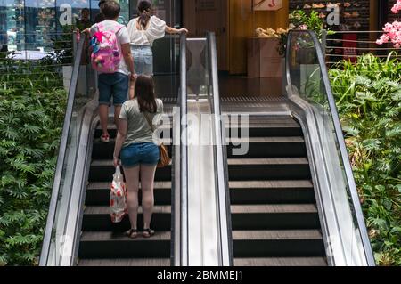 Sydney, Australia - January 26, 2020: People on escalator staircase in shopping centre Stock Photo